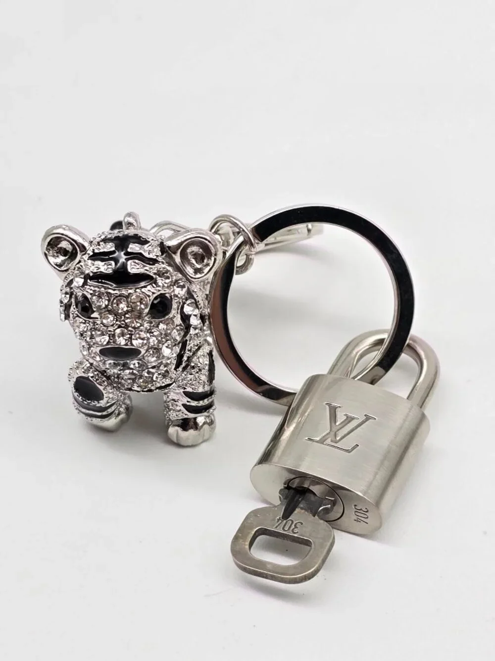 Authentic Louis Vuitton Silver Padlock with Unbranded Silver Tiger Bagcharm